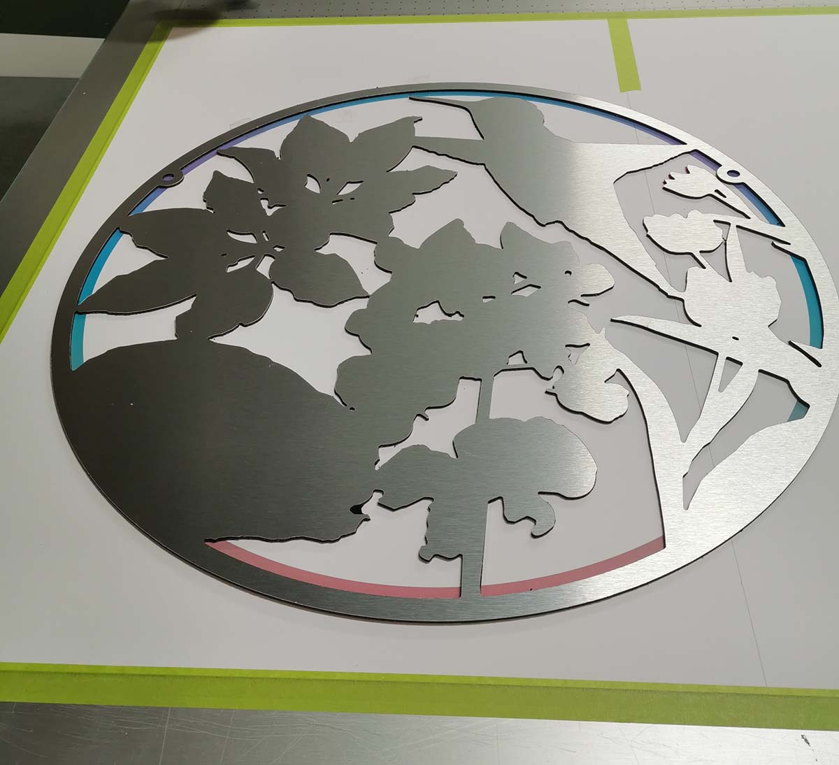 The bare aluminum composite material lying on the printer bed, waiting to be printed